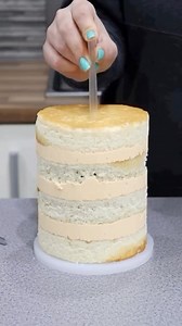 How to Dowel a cake when you use Butter Ganache with Frost Form 🤗 It can be difficult to get dowels through cold Butter Ganache, so placing the dowels in the cake BEFORE pouring the ganache will make it much easier! And always stack your smaller cakes with a thin cake board underneath before pouring the ganache in the form! Order Frost Form on frostform.com 💕 | Frost Form