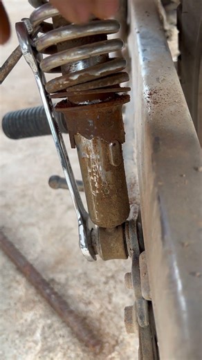 The lever principle is used to lift the spring for adjustment.