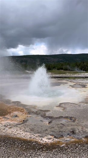Walking in #Yellowstone and this #geyser suddenly starts to erupt #shorts #ytshorts #ytviral #travel