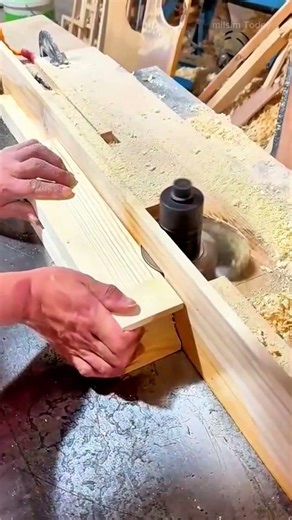 precisely cutting and shaping wooden board into complex structure using heavy spindle moulder machin