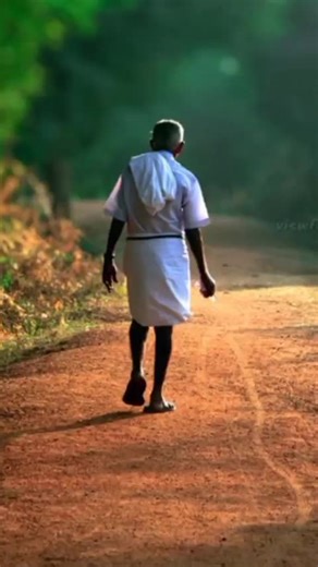 Elderly Man Walking Down a Rural Path in India
