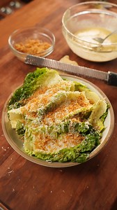 Caesar Salad 🥗 Get the full recipe on derekkchen.com Ingredients Caesar Dressing * 6 anchovy filets(minced) * 3 cloves garlic(grated) * 2 egg yolks * 1 tbsp dijon mustard * 1 tsp Worcestershire sauce * 1 lemon(zest and juice) * 1 cup olive oil * 1/2 tsp honey * 1 cup parmigiano reggiano(grated) * Salt and pepper to taste Breadcrumb Topping * 1/2 cup panko breadcrumbs * 2 tbsp butter * 1 clove garlic * Zest 1/2 lemon * Salt and pepper to taste Greens * Romain/Little Gem lettuce * Ice * Water #ta