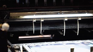 Printing machine works, rolling printed newspaper in typography facility