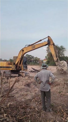 CAT Excavator Operations: Clearing the Field