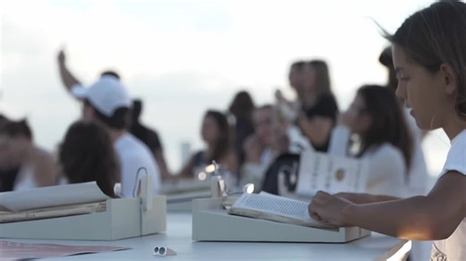 Huge revolving library art-installation lights up the beach for Miami Art Week