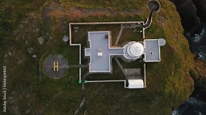 Top-down View Of Lighthouse At Strumble Headland With Helipad In Wales. - aerial ascend