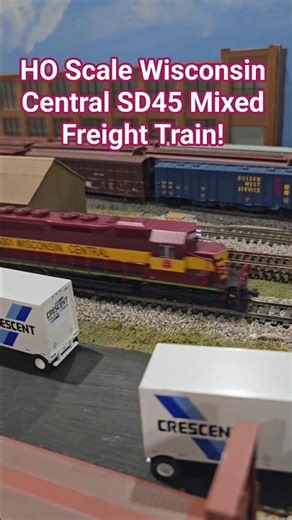 HO Scale Wisconsin Central SD45 Mixed Freight Train Passes Industrial Yard!