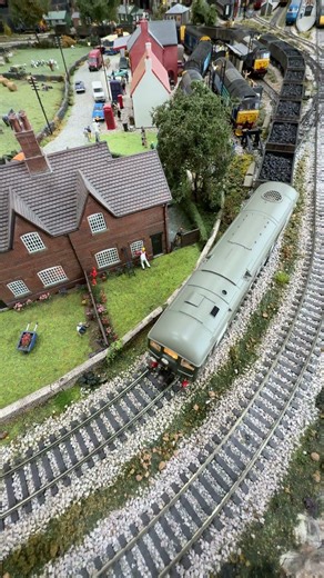 D5094 Class 24 DCC with sound passes the village.