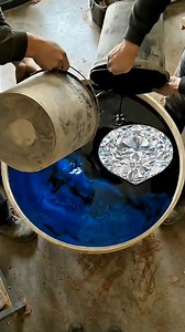 Now THAT is a statement piece for your wall! 💎💙 ​This video shows the amazing process of making a custom wall clock using deep blue resin and a giant diamond centerpiece. It completely transforms the look of this living room. ​Would you hang this in your home? ​. . . #WallDecor #EpoxyArt #ClockDesign #LuxuryLiving #BlueHome #Craftsmanship #DIYInspiration #HomeMakeover | Versa Epoxy