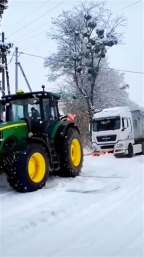 John Deere Tractor Pulls Truck Out of Deep Snow 🚜 #usatractor #truckpull #usashorts #johndeere