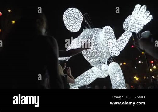 Giant Illuminated Puppet Doll Marionette is Dancing in a crowd of Big Festival in the Night. Sziget, Budapest, Hungary. High quality 4k footage Stock Video Footage - Alamy
