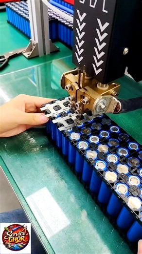 The video displays a person using a spot welding machine to assemble a lithium-ion battery pack #diy