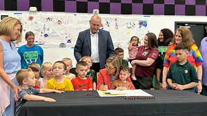 Kim Reynolds signs law expanding Iowa child care assistance. Here's how it works: