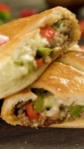 This Italian meat stromboli is a total crowd-pleaser packed with layers of salami, pepperoni, ham, and melty cheese all rolled up in pizza dough and baked until golden. Slice it up and serve with warm marinara for dipping. It’s easy, satisfying, and perfect for game day, dinner, or anytime you’re feeding a hungry crew. https://thestayathomechef.com/stromboli/ | The Stay At Home Chef