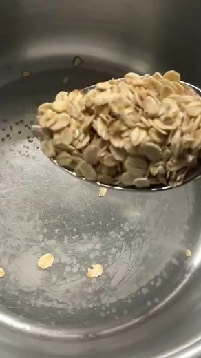 Savory porridge oatmeal with cheese and a boiled egg. A healthy breakfast idea.