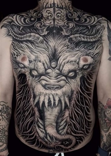 Lion and Demon Encounter in Dark Art Tattoo