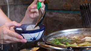 burn hand with boiling water burn girl burns hand with hot soup pour boiling broth in a large stream splashes hit skin painfully pull hand away