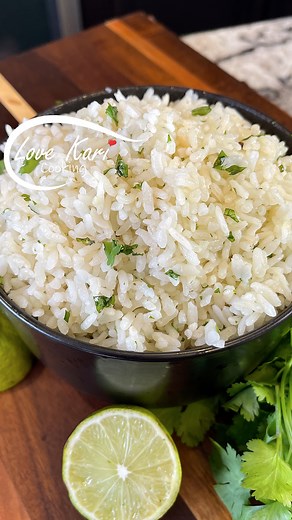 Cilantro Lime Rice Easy Recipe Arroz con Cilantro y Mantequilla. It's the perfect accompaniment to burritos, fish, and rice bowls 😋 I hope you enjoy this recipe. Please comment down below what recipe you will like to see next. Also, check out our YouTube Channel for more delicious recipes. Link in Bio 😊 CILANTRO LIME RICE INGREDIENTS: ► 1 cup of white rice ► 2 minced garlic cloves ► 2 cups of hot water ► 1/2 tsp salt ► 1/2 tsp chicken bouillon ► Juice of 1/2 lime ► Some butter ► Some cilantro 