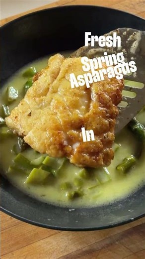 Seared cod with fresh asparagus in a fish stock with lemon and emulsified butter