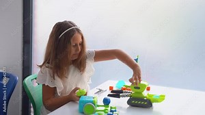 School student studying technology, using joystick control panel with automatic remote car toy. Coding, programming basis for kids Stock Video