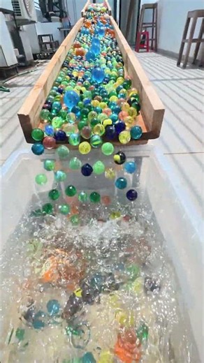 Glass Marbles Spin Through a Circular Raceway