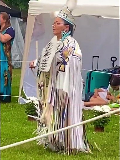 BEAUTIFUL POWWOW DANCING: watch the movement of dancers in their colourful regalia to the drumbeat.