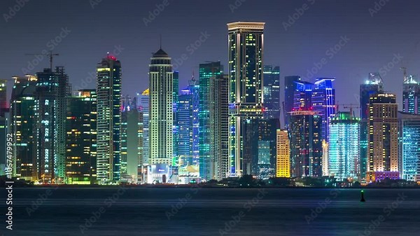 DOHA, QATAR - OCTOBER 25, 2024: Night skyline of Doha featuring illuminated skyscrapers along the waterfront showcasing vibrant city life