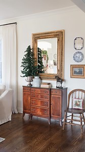 ✨ Decided it was time to update this wall. It’s been on my to do list but wanted to do it it on a budget. Found this vintage mahogany sideboard the other day and grabbed the mirror for $40 a few weeks back. With a few other collected thrifted finds it all came together. My overall goal is potentially a built in bookcase here but we shall see. I like the little collection here but my I’ve been wanting a bookcase. Hmm #thriftedhome #howihome #thriftstorefind #thriftingfinds #livingroom | Amelia La