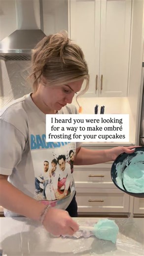 Ashley Sterba | Home Baker & Teacher on Instagram: "Such a COOL look 😎 is THAT easy 🤩 1. Make your frosting colors 2. Lay out plastic wrap 3. Make rows of your colors 4. Roll up your plastic wrap 5. Cut the edge and put into a piping bag 6. Watch the magic ombré appear when you pipe 🫢didn’t realize I looked so scary at the end 🤣 sorry - early morning bake sessions 🤪"