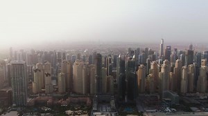 The city skyline is seen from above in the morning