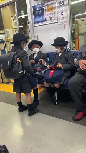Exploring Train Life: Children Riding in Tokyo