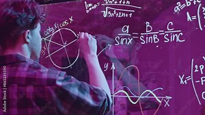 Young man solves mathematical equations on blackboard. Media. Young man solves complex equations on transparent board. Genius writes equations on blackboard in neon light