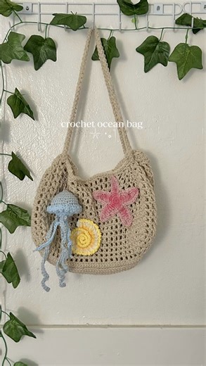 danyell felix | crochet ocean bag 𓇼⋆｡˚ patterns i followed bag - KG korn (yt) jellyfish- Despicable Damsel (yt) starfish- Loveable Loops (yt) Seashell-... | Instagram