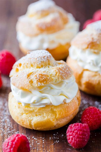Cream Puffs are a classic French dessert filled with sweet cream and dusted with powdered sugar. RECIPE: https://natashaskitchen.com/cream-puffs-recipe/ | NatashasKitchen.com