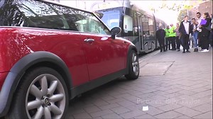 Tram Jam: this car brought Nottingham's trams to a halt today when it was parked...well, you can see. A crowd formed outside Nottingham Trent Uni and trams were delayed by 15 minutes. In the end the passengers took matters into their own hands. Literally. | BBC Nottingham