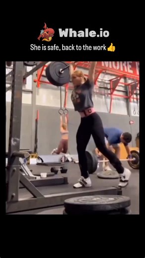 giggyvibe on Instagram: "The post features a 17-second gym video of a woman performing heavy deadlifts, appearing to struggle and briefly collapse under the barbell, but she quickly recovers and continues, captioned reassuringly that she's safe and back to work. With over 875,000 views and 4,000+ likes in under 24 hours, it taps into viral fitness humor about the "bystander effect" in gyms, where nearby lifters remain focused despite the apparent mishap. Replies blend lighthearted jabs at gender