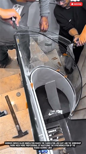 Worker cutting curved glass patterns with precision tools for dynamic production results