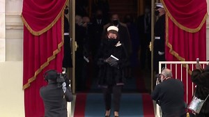 Capitol Police hero Eugene Goodman, who helped draw rioters away from the Senate two weeks, escorts Vice President-elect Kamala Harris to the 59th inauguration ceremony. | WXII 12 NEWS