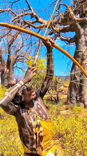 African Hunter Fires Arrow at a Mongoose on a Tree Branch.#shortvideo #hunting