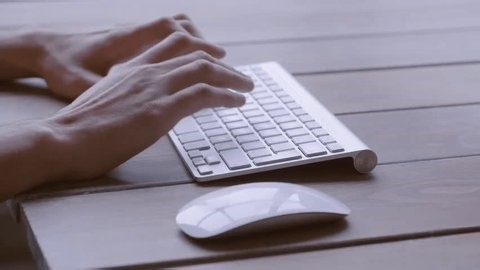 clip-4002025317-hands-drafting-script-on-mechanical-keyboard-cinematic