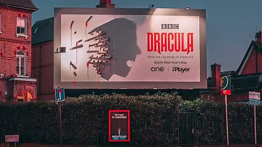 Billboard poster for 'Dracula' reveals itself as it gets dark