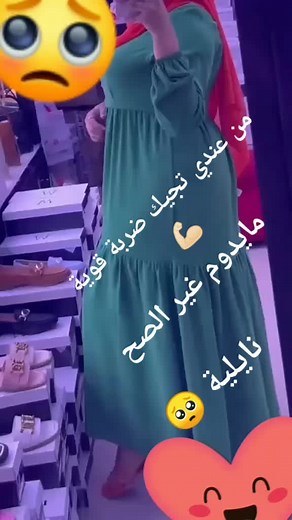 Fashion Showcase: Green Dress and Red Scarf in Store