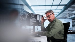 Unhappy Sad Developer Programmer Man In Stress Coding Software On Computer