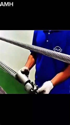 Stockbridge damper installation protects power lines. ​#PowerLineProtection #VibrationDamping | Az0782