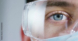 Close up of a scientist with futuristic graphics with which scans and reads the DNA. Concept: immersive technology, augmented reality, science and research.