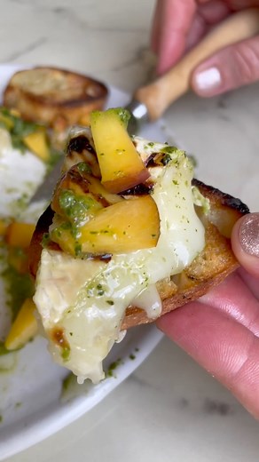 6.8K views · 160 reactions | Grilled Brie with Peaches and Pesto takes sweet, juicy peaches, nutty pesto and melty, mellow brie and turns them into your new summer grilling obsession! https://thebakermama.com/recipes/grilled-brie-with-peaches-and-pesto/ | The Bakermama | Facebook