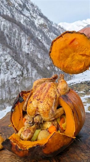 Wilderness cuisine on Instagram: "• Chicken cooked inside pumpkin with lots of vegetables 🎃🍗 • One-pot pumpkin chicken recipe • Rustic pumpkin chicken in the mountains 🏔️🔥 • Natural cooking, real taste • Pumpkin stuffed chicken with veggies#outdoorcooking #pumpkinchicken #stuffedpumpkin #mountaincooking #campfood #rusticfood #shorts #reels"