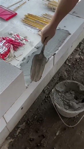Placing wet cement on a large concrete block to support another block above today during work#viral