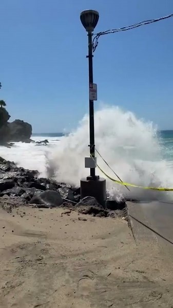 Massive waves slam Laguna Beach parking lot amid high surf