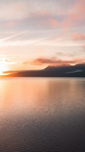 Lakes and sunrises are our specialty ✨ When the morning mist lifts off the lake and the sky turns to gold, that’s Rotorua magic 🌅 | Rotorua NZ